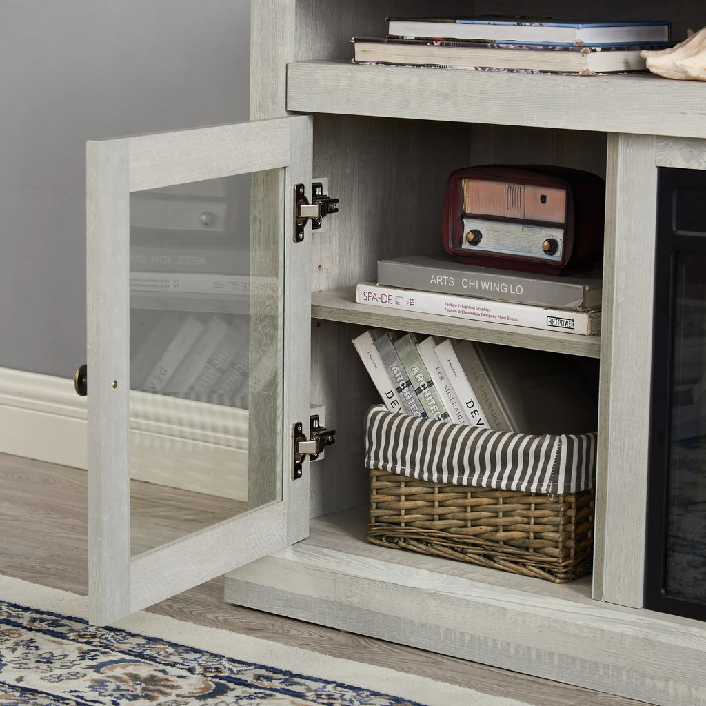 Light wood cabinet with glass door, books, striped basket, and vintage radio in a modern living room