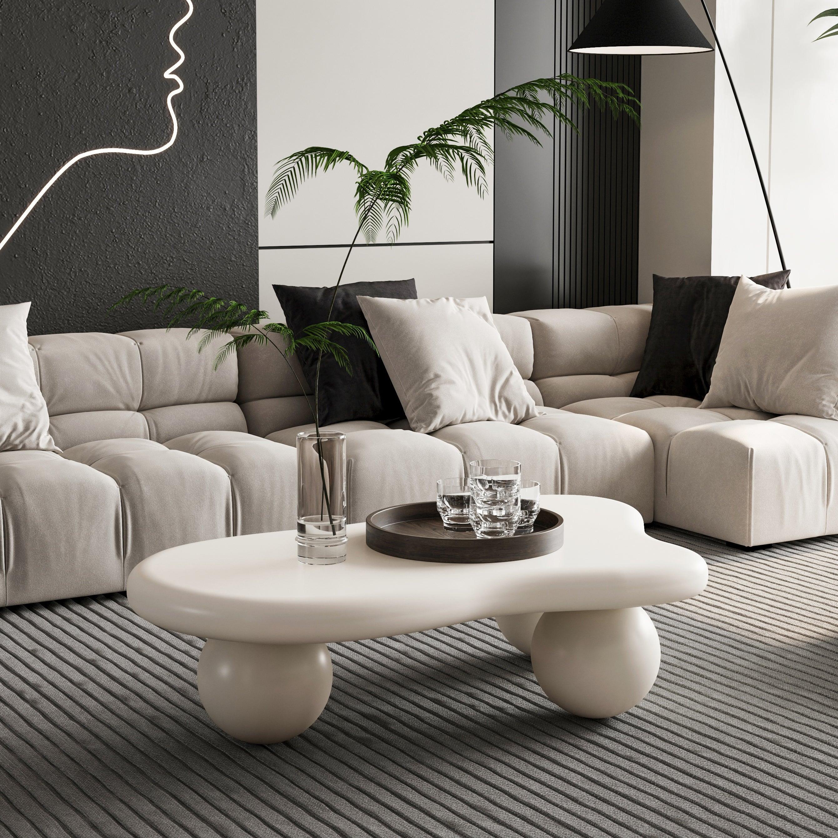 Modern modular sectional sofa with plush cushions, round coffee table, and contemporary decor in a stylish living room.