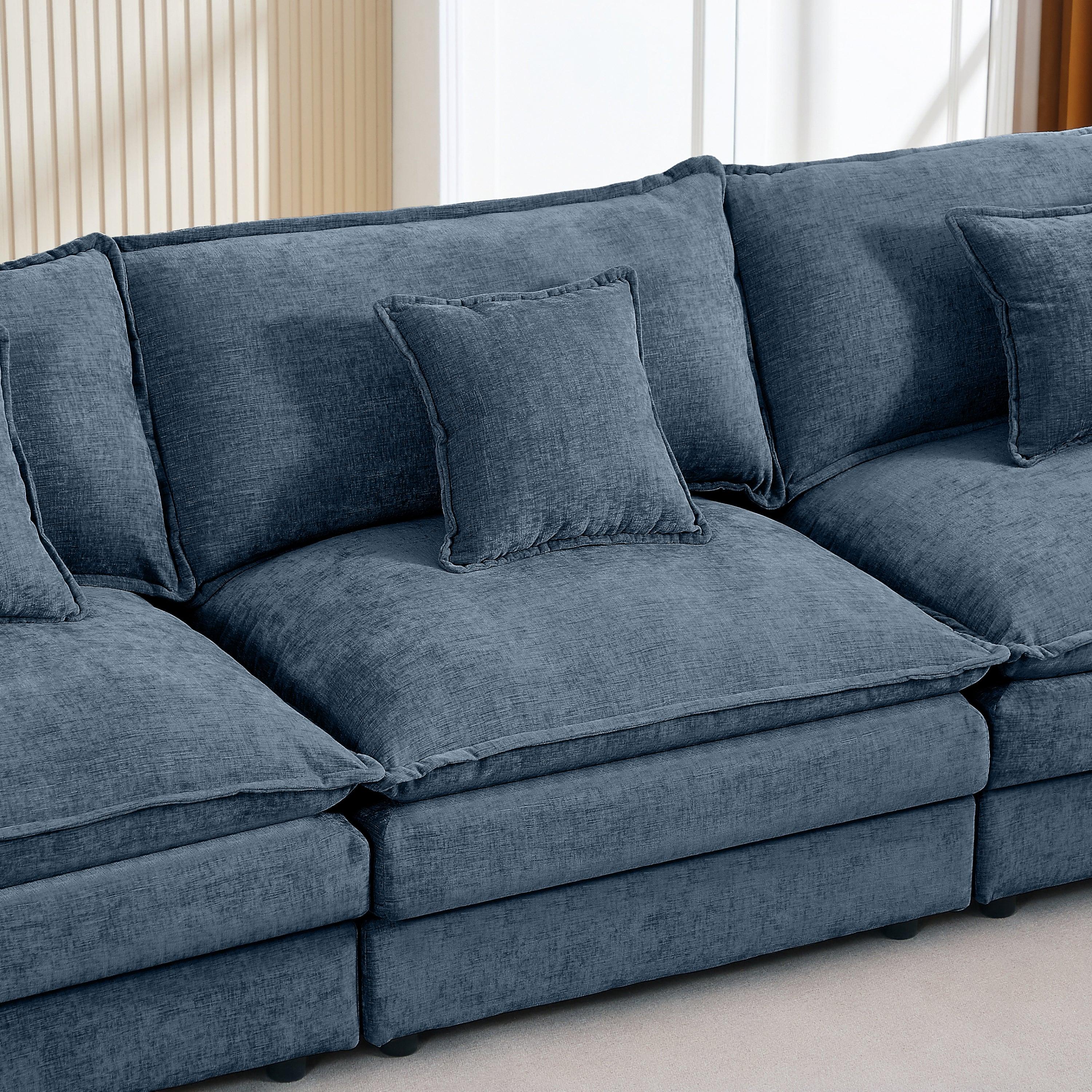Modern blue modular chenille sectional sofa with plush cushions in a bright living room
