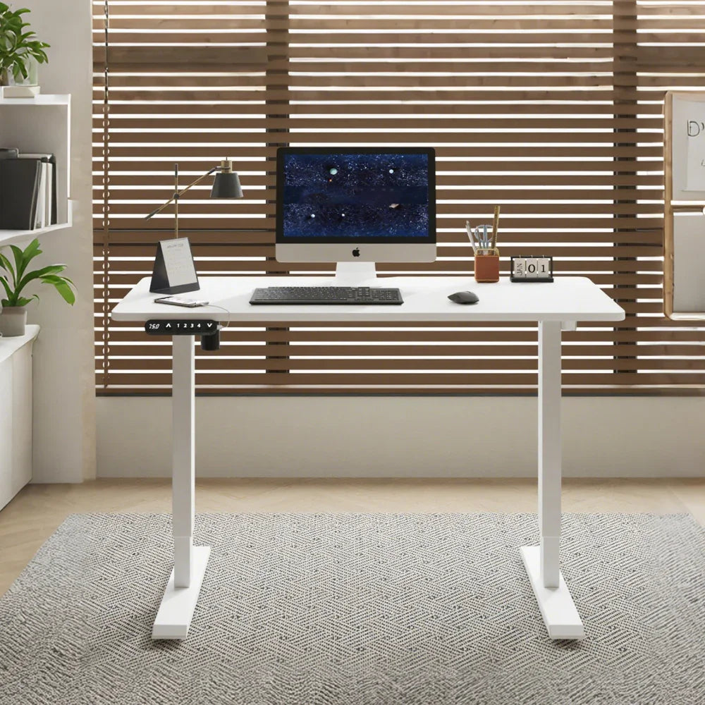 Modern white standing desk with computer in contemporary home office setting